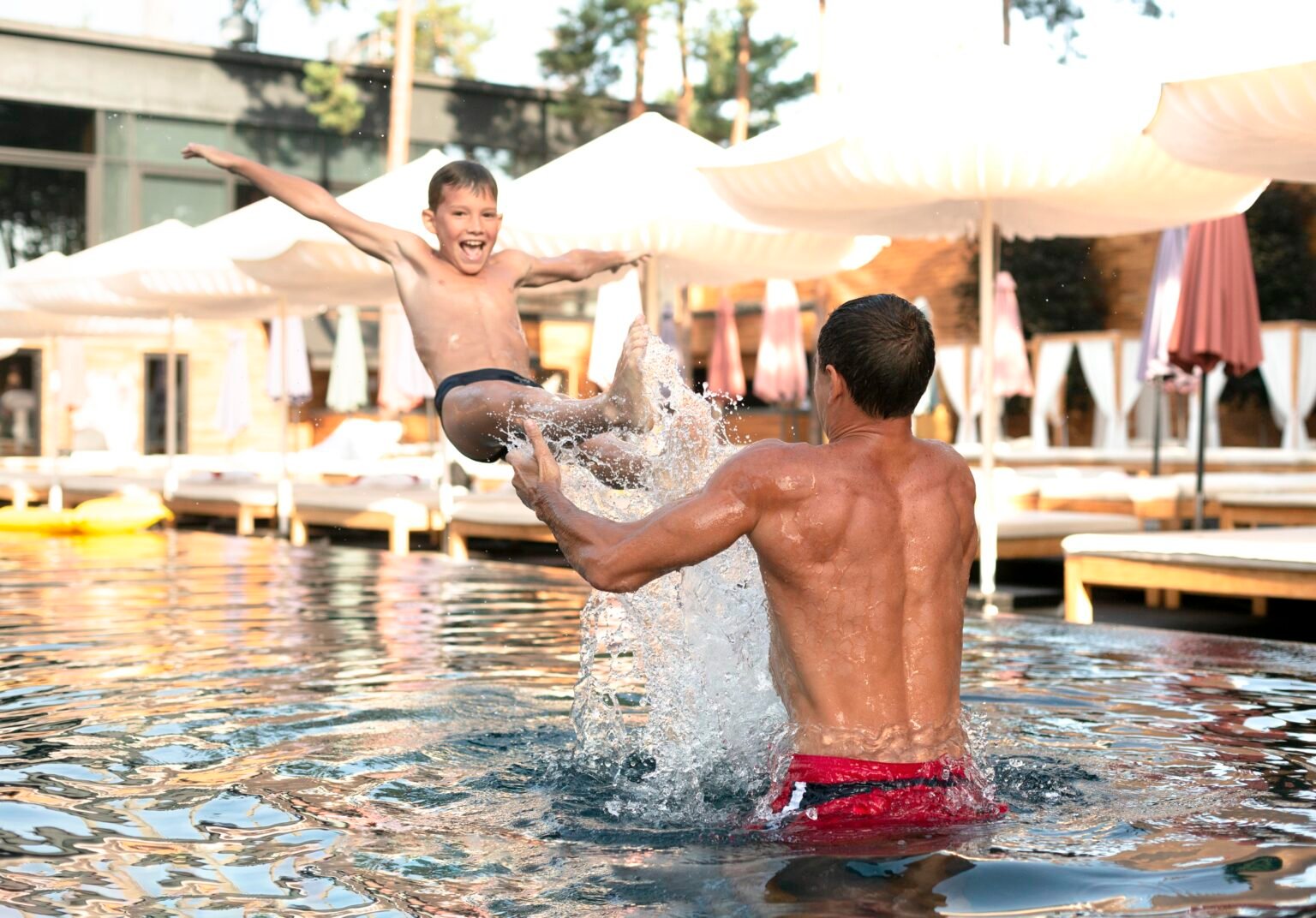 Father son enjoying day swimming pool together 1536x1072