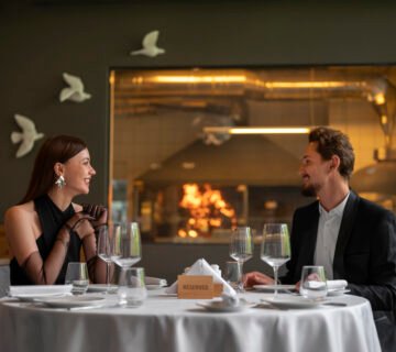 Medium shot couple having lunch luxury restaurant 360x320