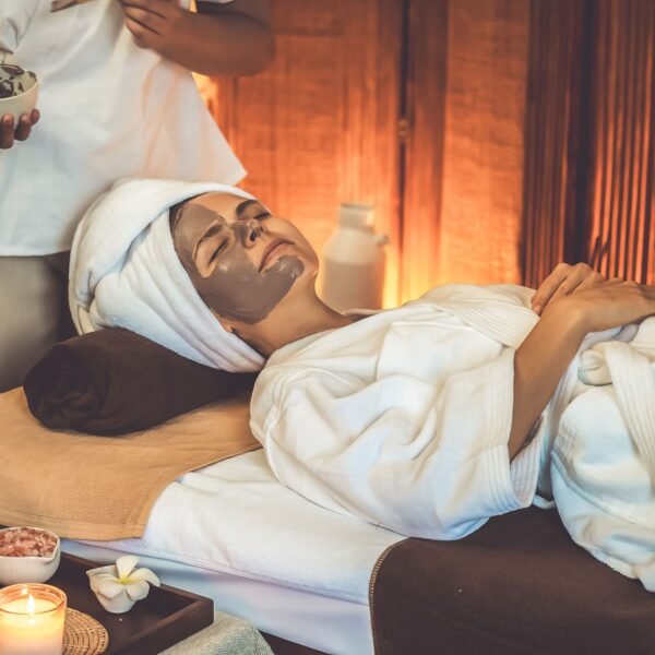 Serene ambiance spa salon woman customer indulges rejuvenating with charcoal face cream massage with warm lighting candle facial skin treatment beauty care concept quiescent 600x600